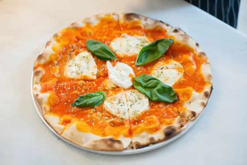 Margherita Pizza with fresh basil and mozzarella